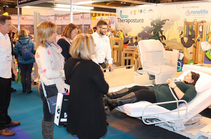 demonstrating adjustable beds at the OT Show