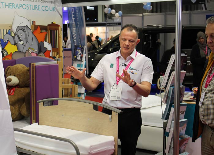Shaun Master OT demonstrating adjustable foot rest