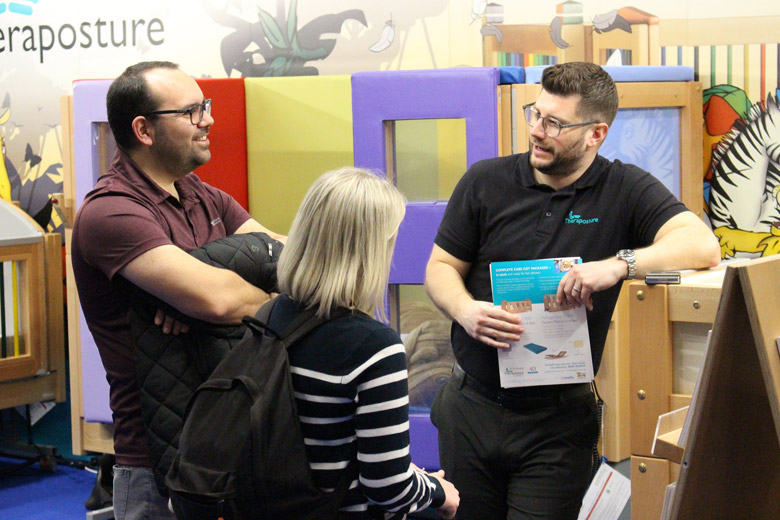 People talking on exhibition stand